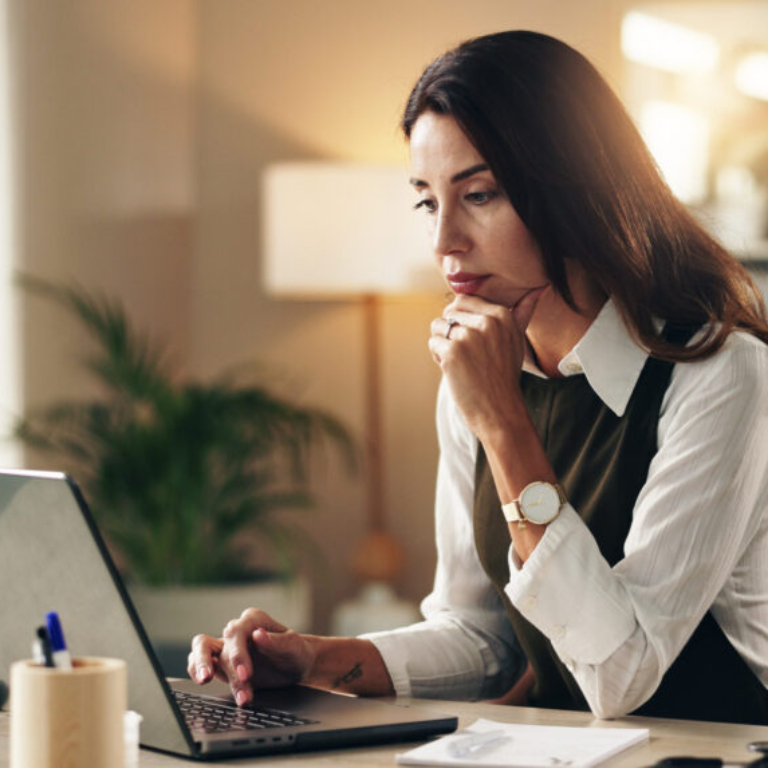 Woman, doctor or thinking in office with laptop, online consultation or healthcare research. Mature.