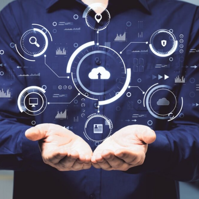 Hands holding abstract digital business interface representing cloud ERP and AI-driven insight for Irish organisations