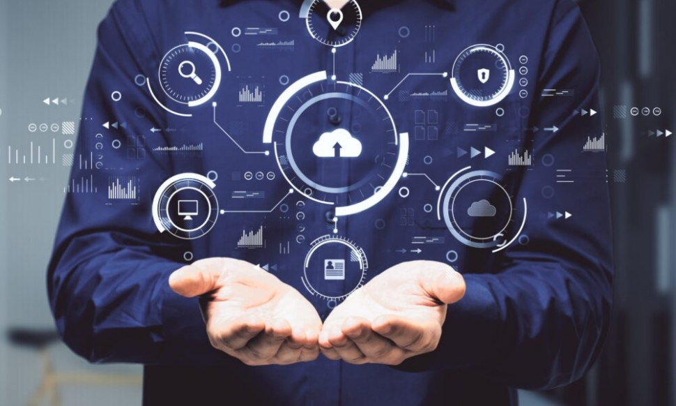 Hands holding abstract digital business interface representing cloud ERP and AI-driven insight for Irish organisations